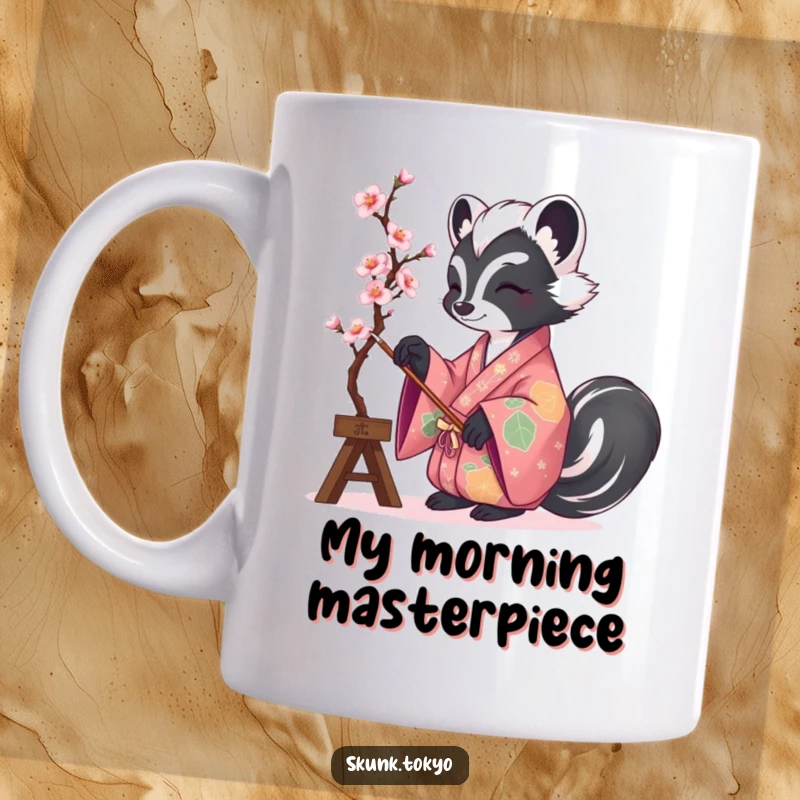 Funny coffee mug featuring a skunk elegantly dressed in a vibrant kimono, artfully painting a delicate cherry blossom branch.
