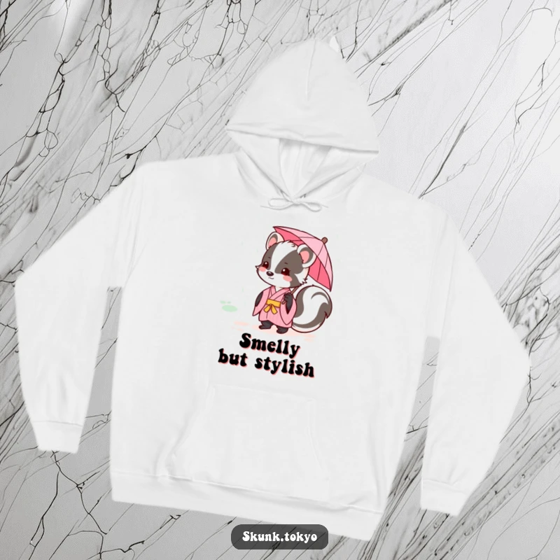Funny kawaii skunk in a pink kimono, holding a tiny umbrella during a gentle rain, soft and cozy hoodie.