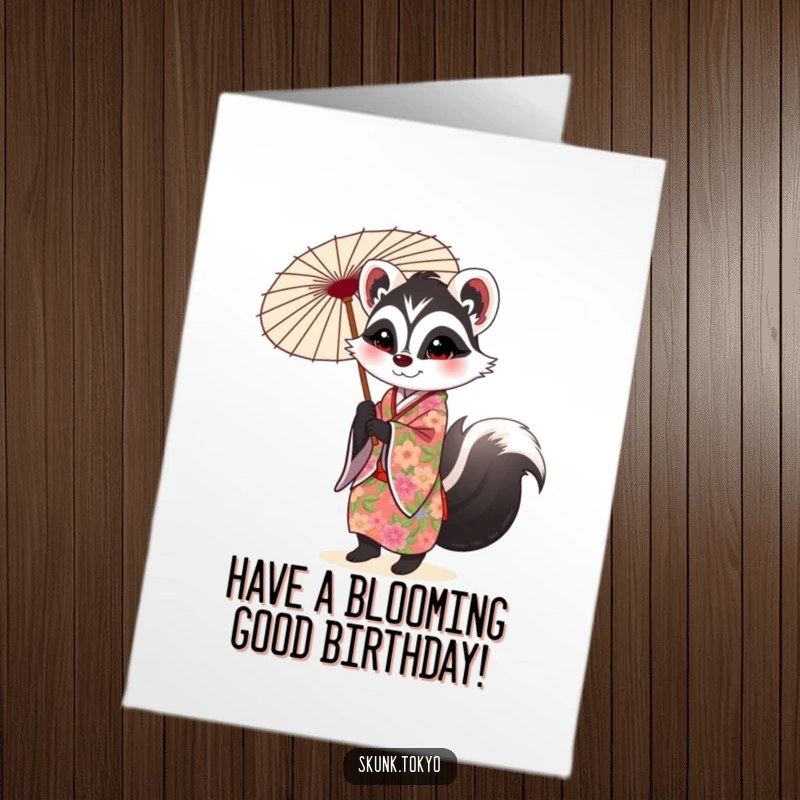 Funny Free Printable Birthday Card: A cute skunk in a vibrant floral kimono gracefully twirls a decorated parasol, wishing you a happy birthday.