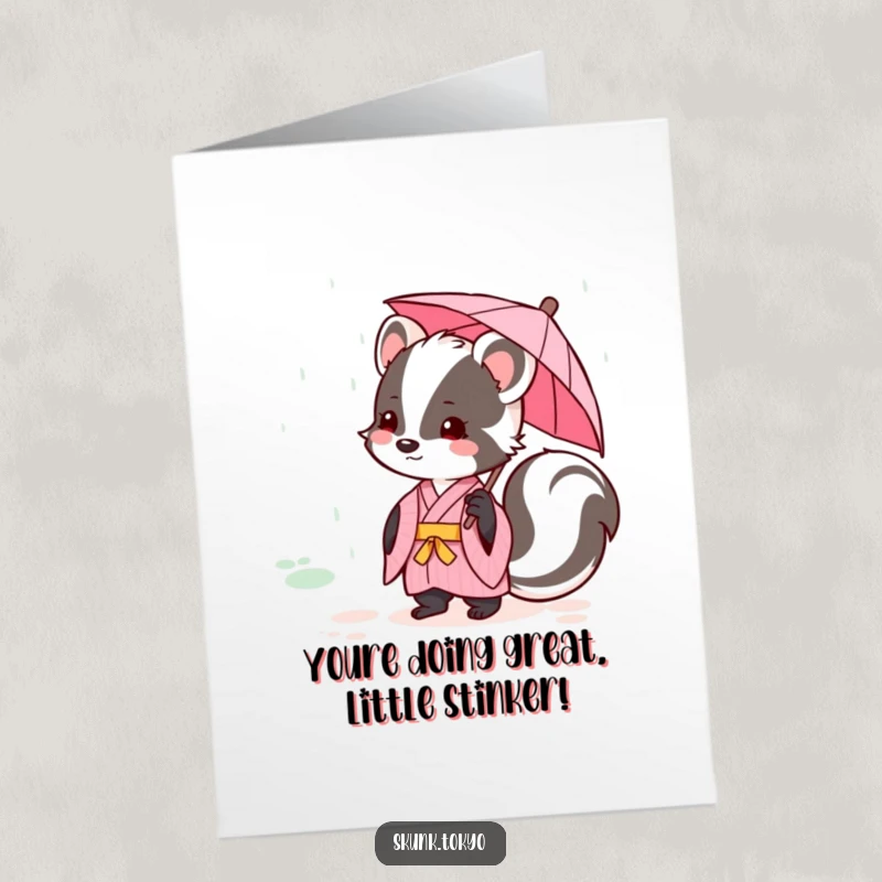 Funny Free Printable Congratulations Card showing a kawaii skunk in a pink kimono with an umbrella, celebrating.