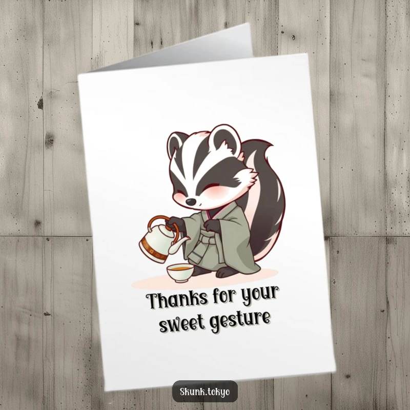 Funny Free Printable Thank You Card: A skunk in a kimono carefully pours tea from a miniature kettle, sending thanks with a smile.