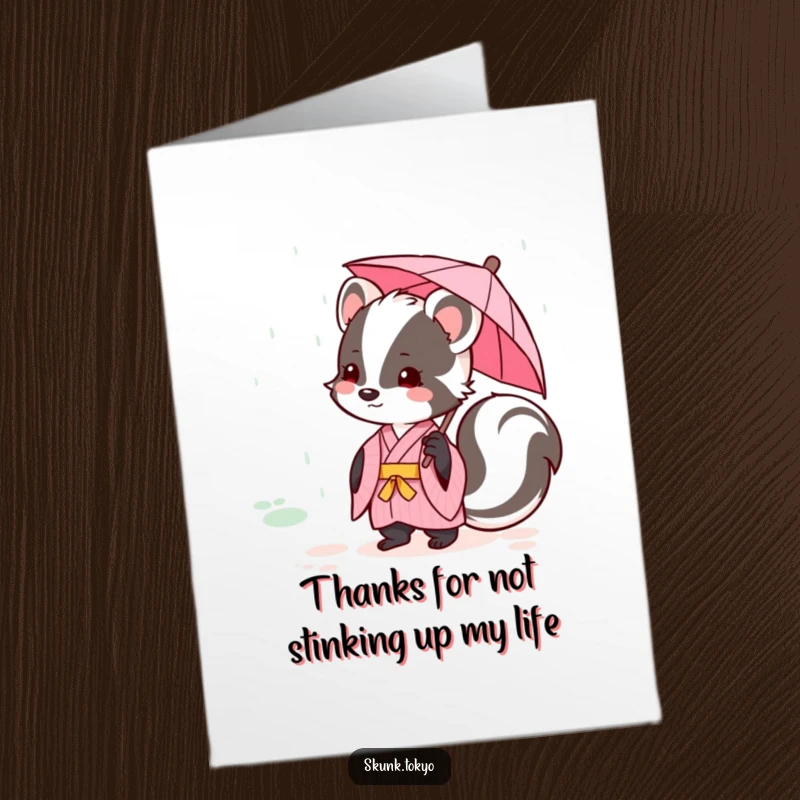 Funny Free Printable Thank You Card with a kawaii skunk in a kimono, holding an umbrella and smiling gratefully.
