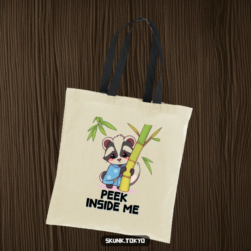 Funny kawaii skunk tote bag, in a blue kimono, playfully peeking from behind bamboo, a chic and humorous accessory.