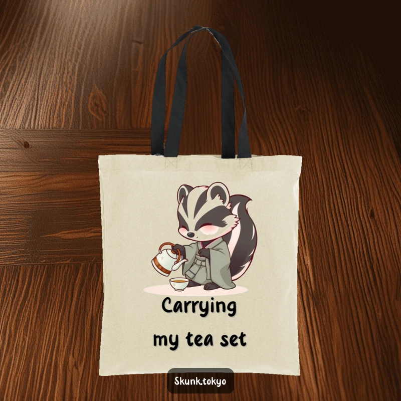 Funny Skunk Tote Bag: A skunk in a kimono carefully pours tea from a miniature kettle, ideal for carrying items with elegance.