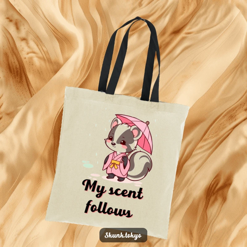 Funny kawaii skunk in a pink kimono with a tiny umbrella, enjoying a gentle rain, a cute and functional tote bag.